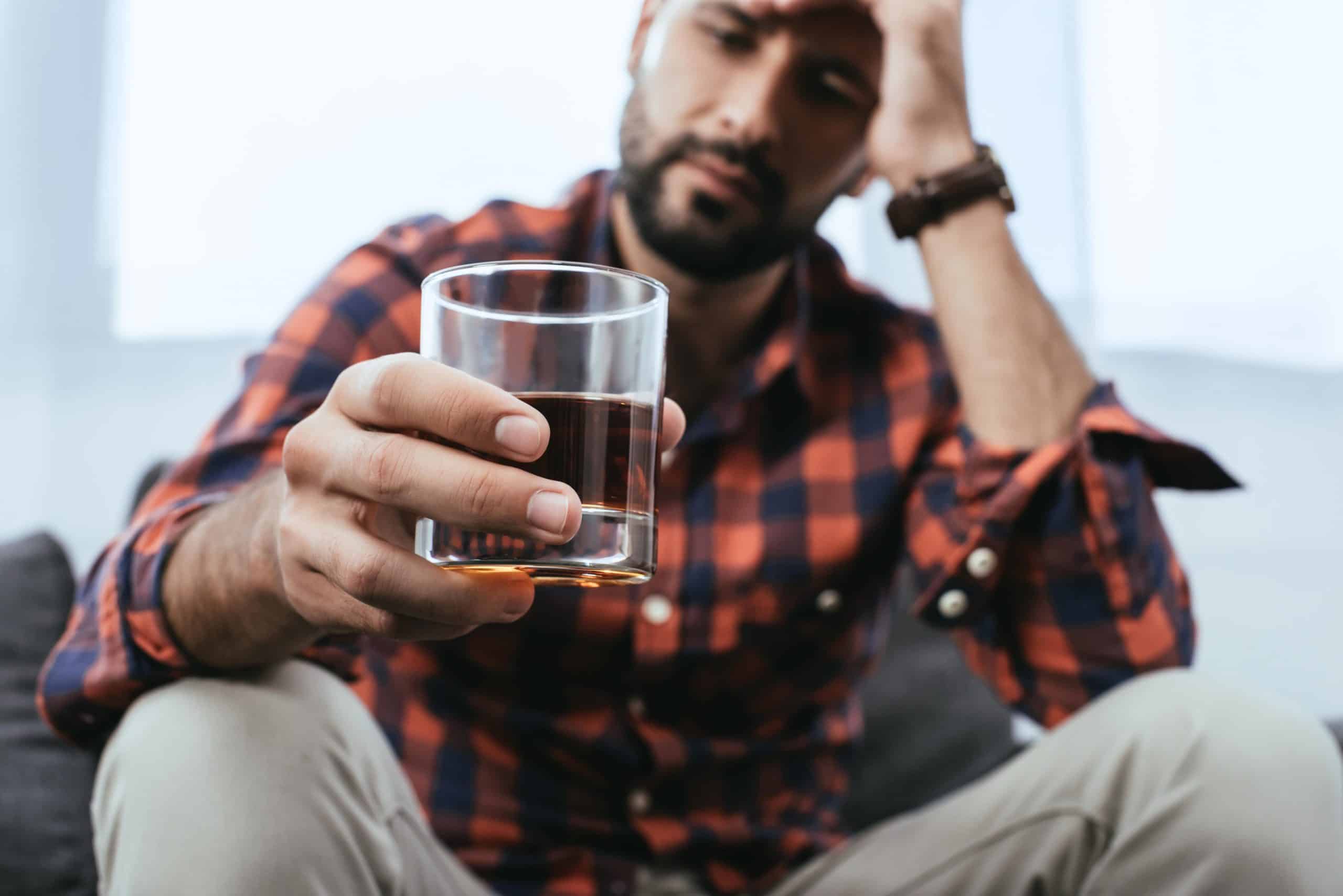 A man wondering if he needs alcohol rehab in Nashville.