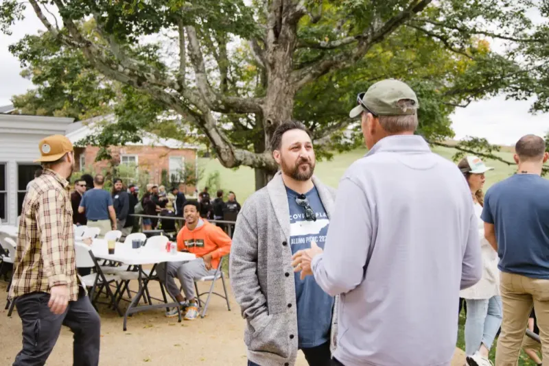 Discover Living Program 1 photo of two men talking
